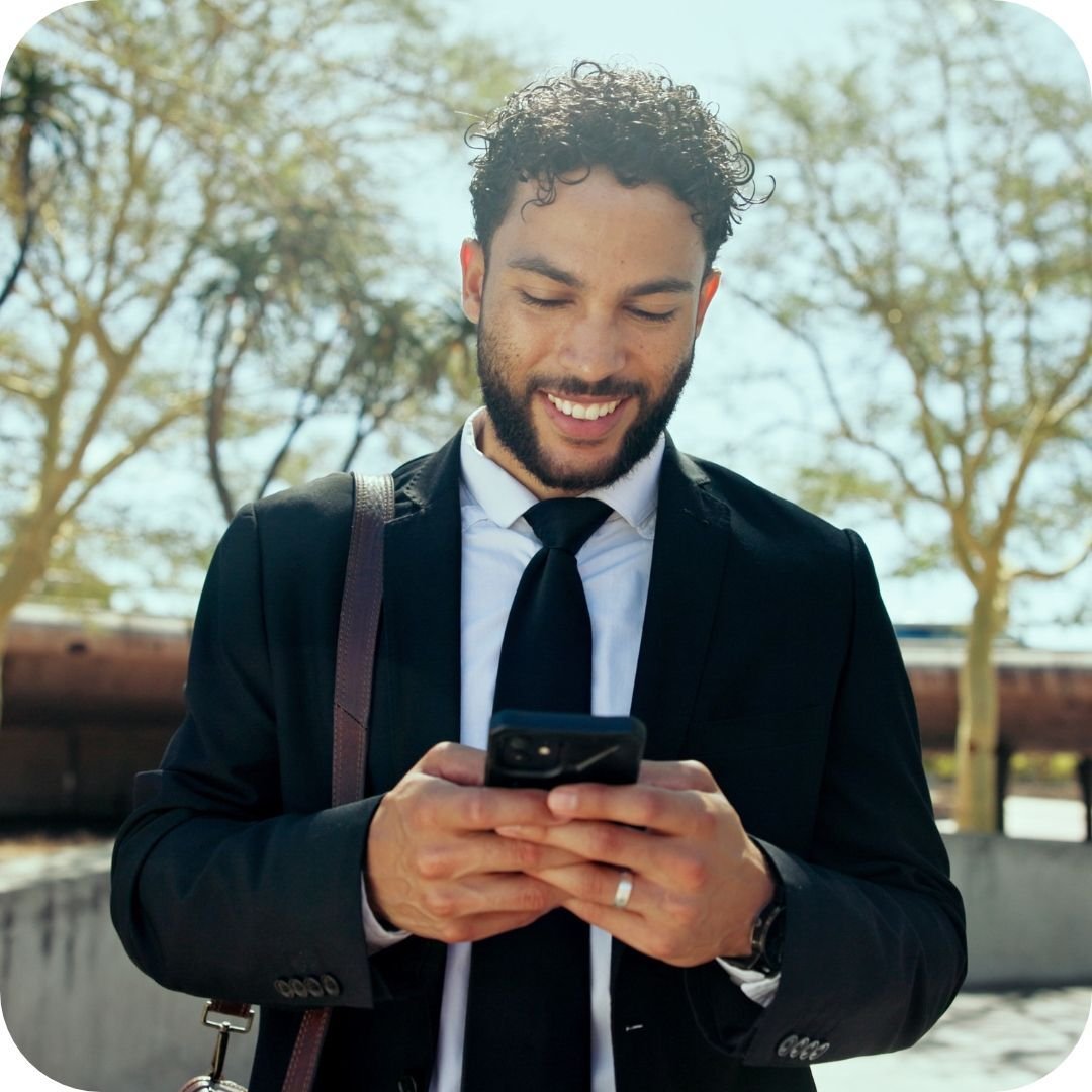 1-businessman-phone-happy-city-texting-park-notification-chat-outdoor-commute-person-low-angle-excited-with-contact-deal-networking-email-mobile-app-colombia (1)