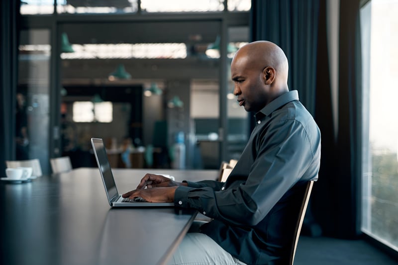 businessman-thinking-laptop-office-boardroom-company-web-design-target-audience-research