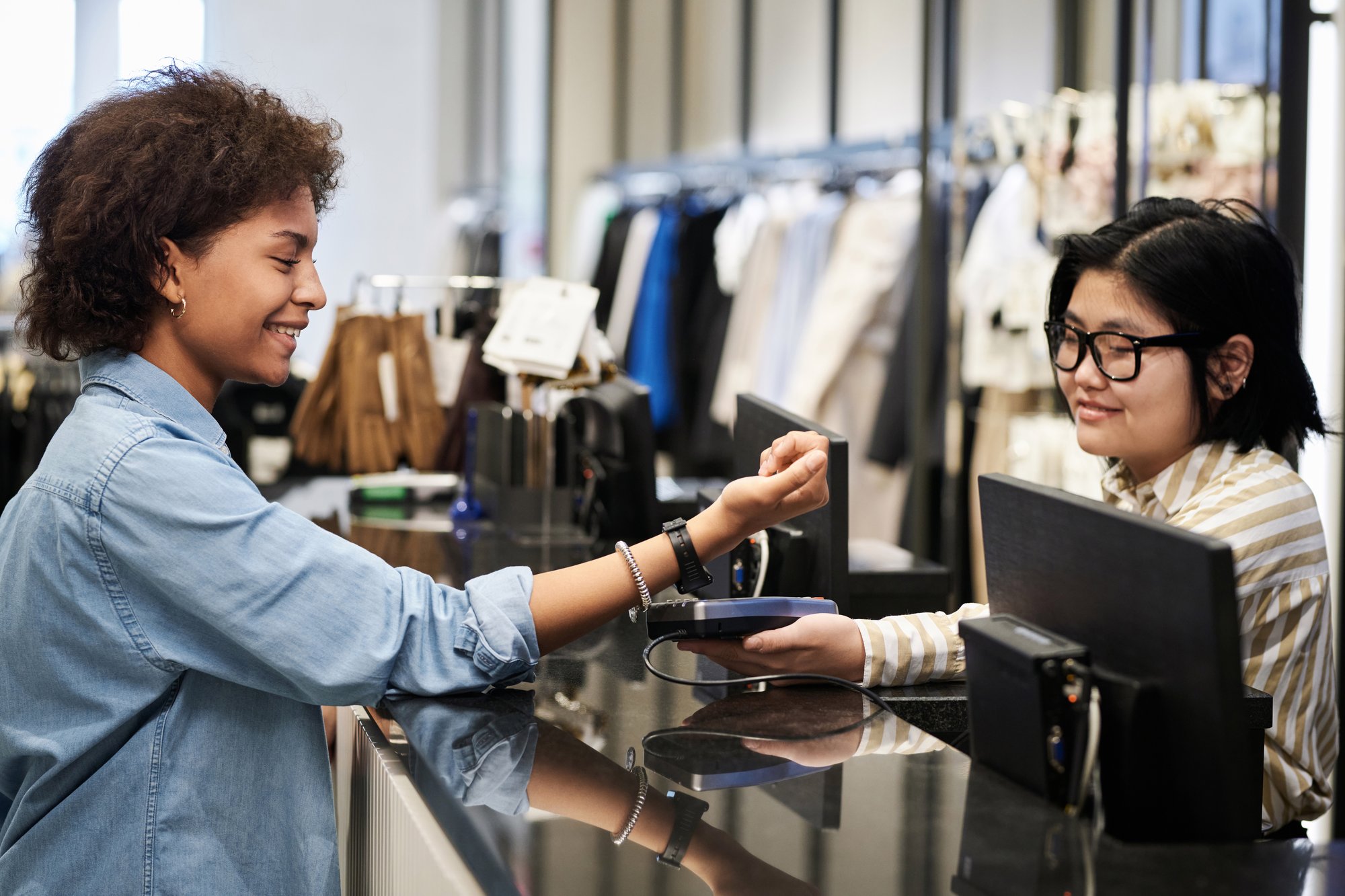 woman-making-payment-for-her-purchases-with-smartw-2025-02-11-15-30-52-utc