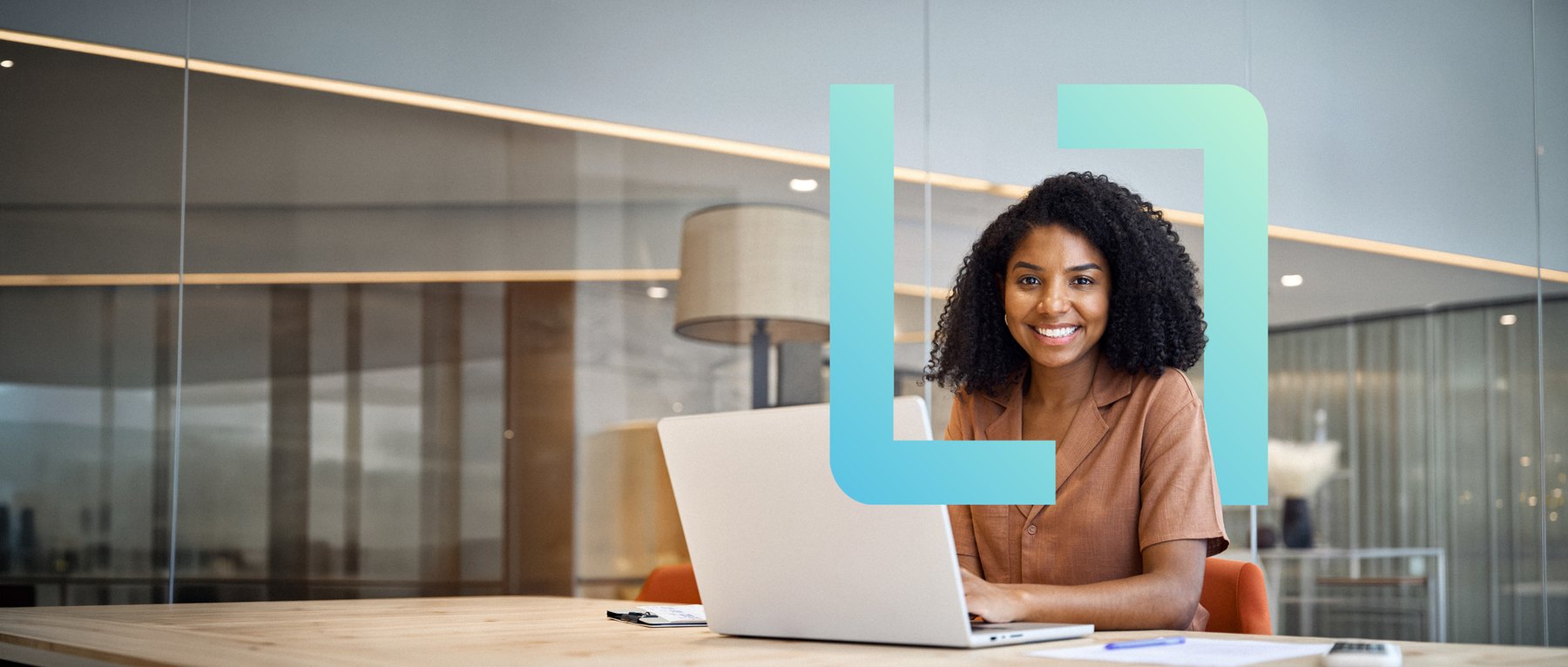 An HR leader at her desk in an open-plan office, framed by the Altron viewfinder