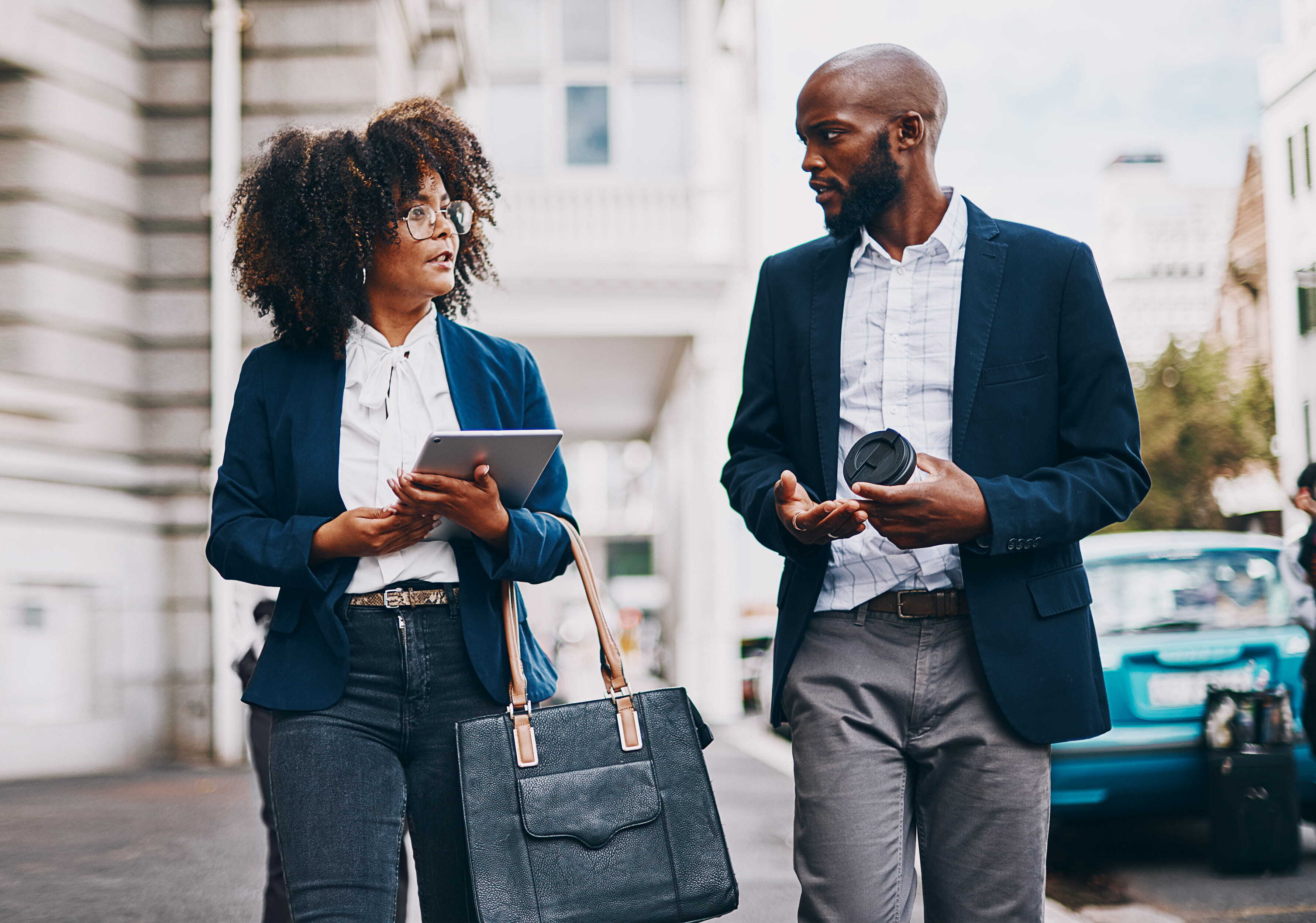 business-people-walking-city-with-talking-commute-travel-journey-conversation-finance-corporate-team-employees-sidewalk-discussion-planning-briefing-networking (1)