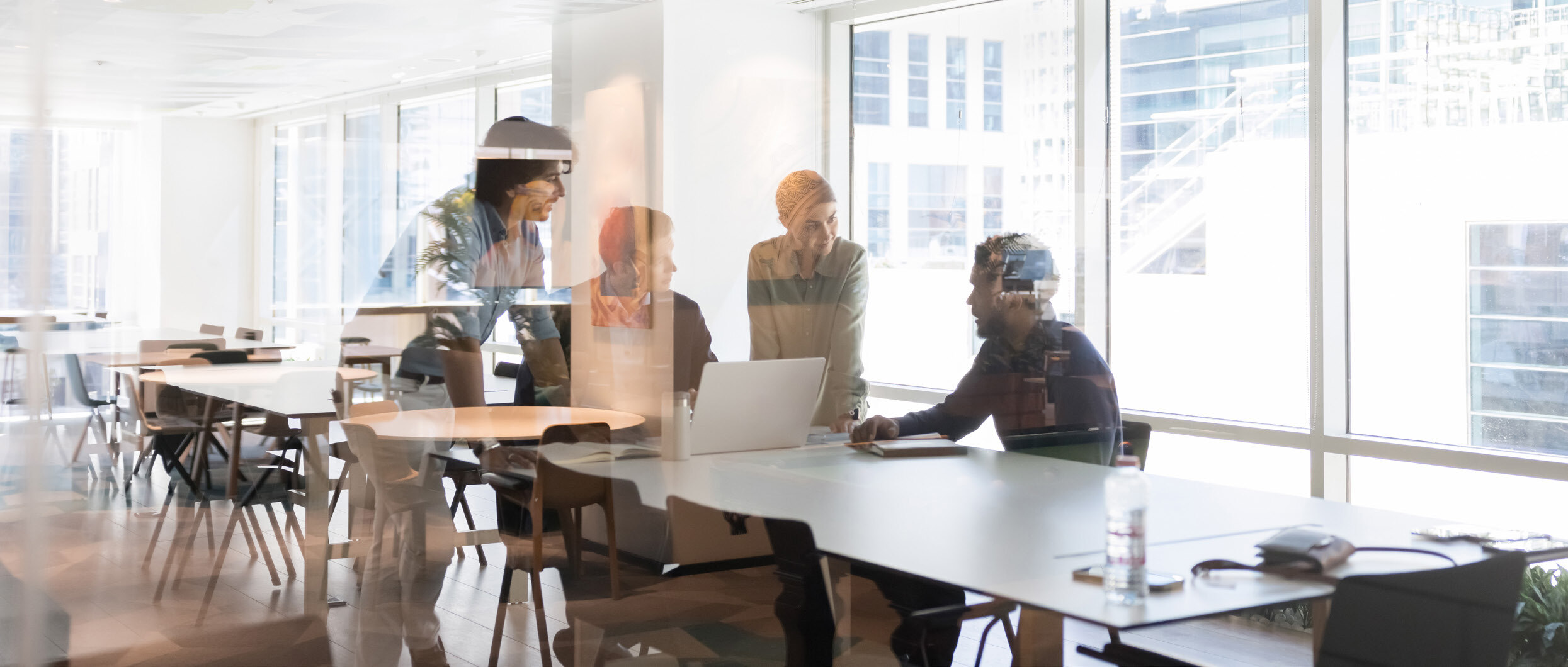 A diverse team of banking and insurance professionals in conversation