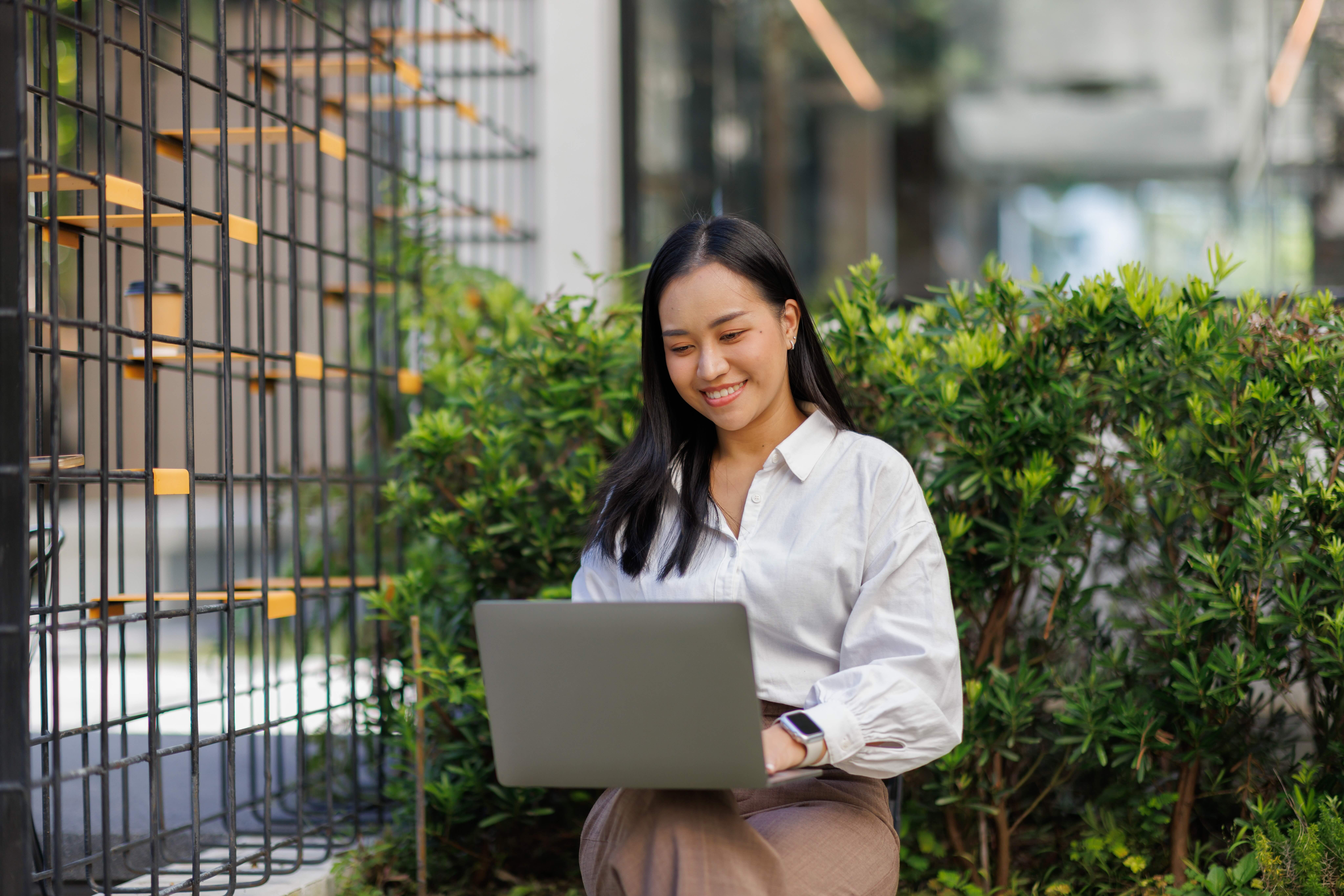 Professional working on a laptop outdoors