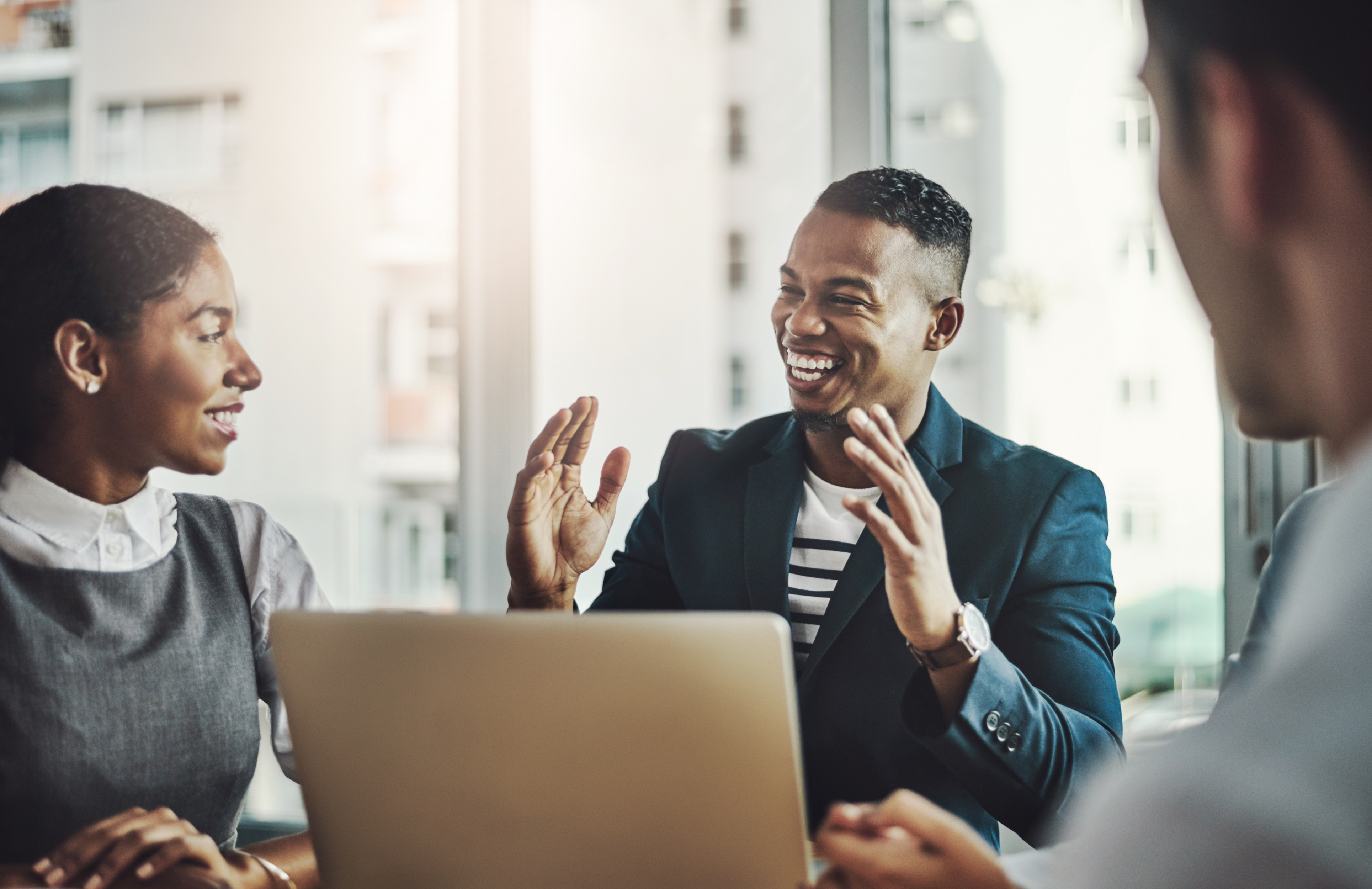 laptop-meeting-man-with-business-people-laugh-office-growth-analyst-opportunity-idea-teamwork-report-consultant-with-employees-corporate-firm-planning-conference