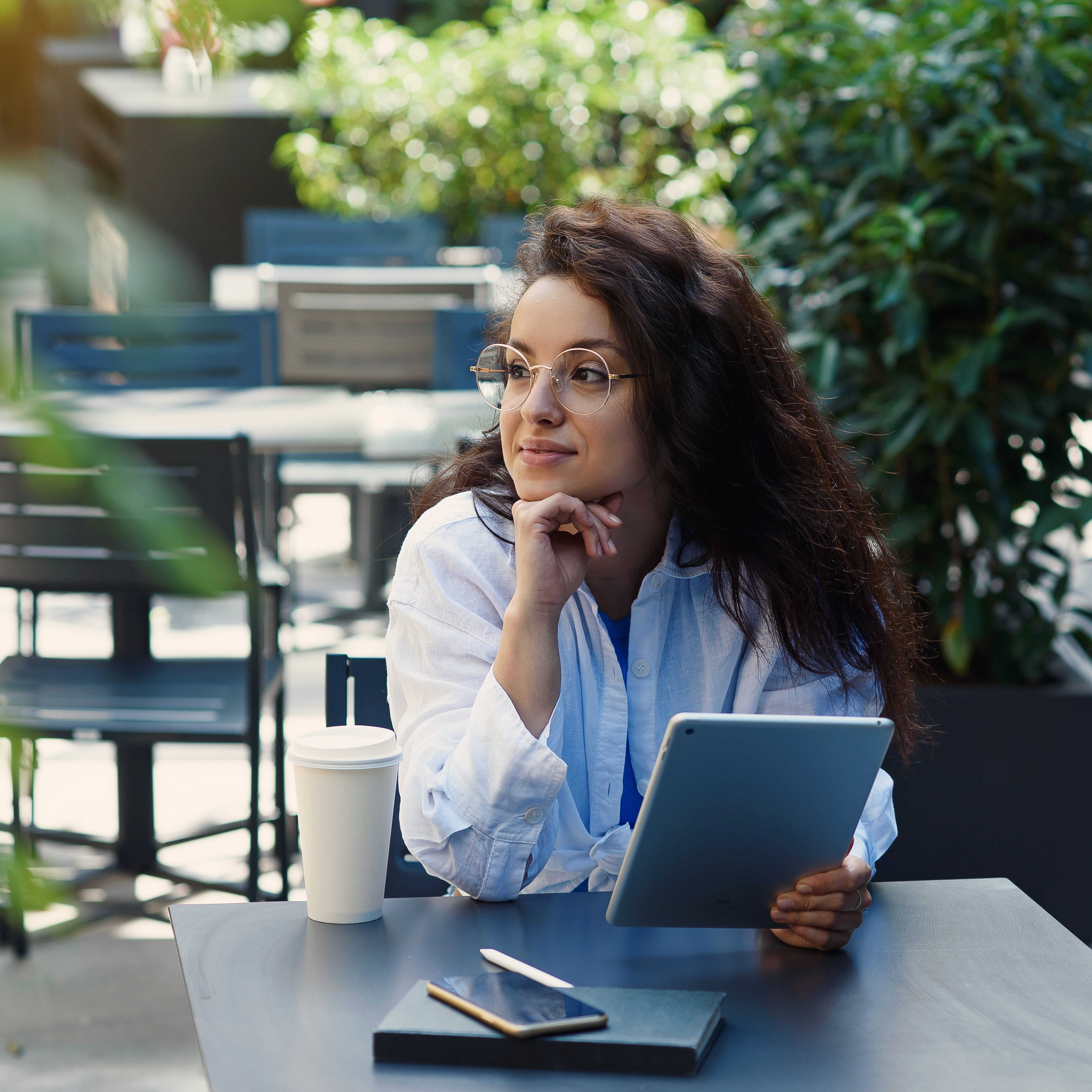 woman-with-cup-coffee-working-outdoor-cafe-morning (1)